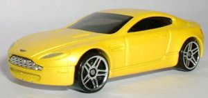 Description: D:\carls system\Toy Cars\Car pics\aston-martin-v8vantage-yellow-hotwheels.jpg